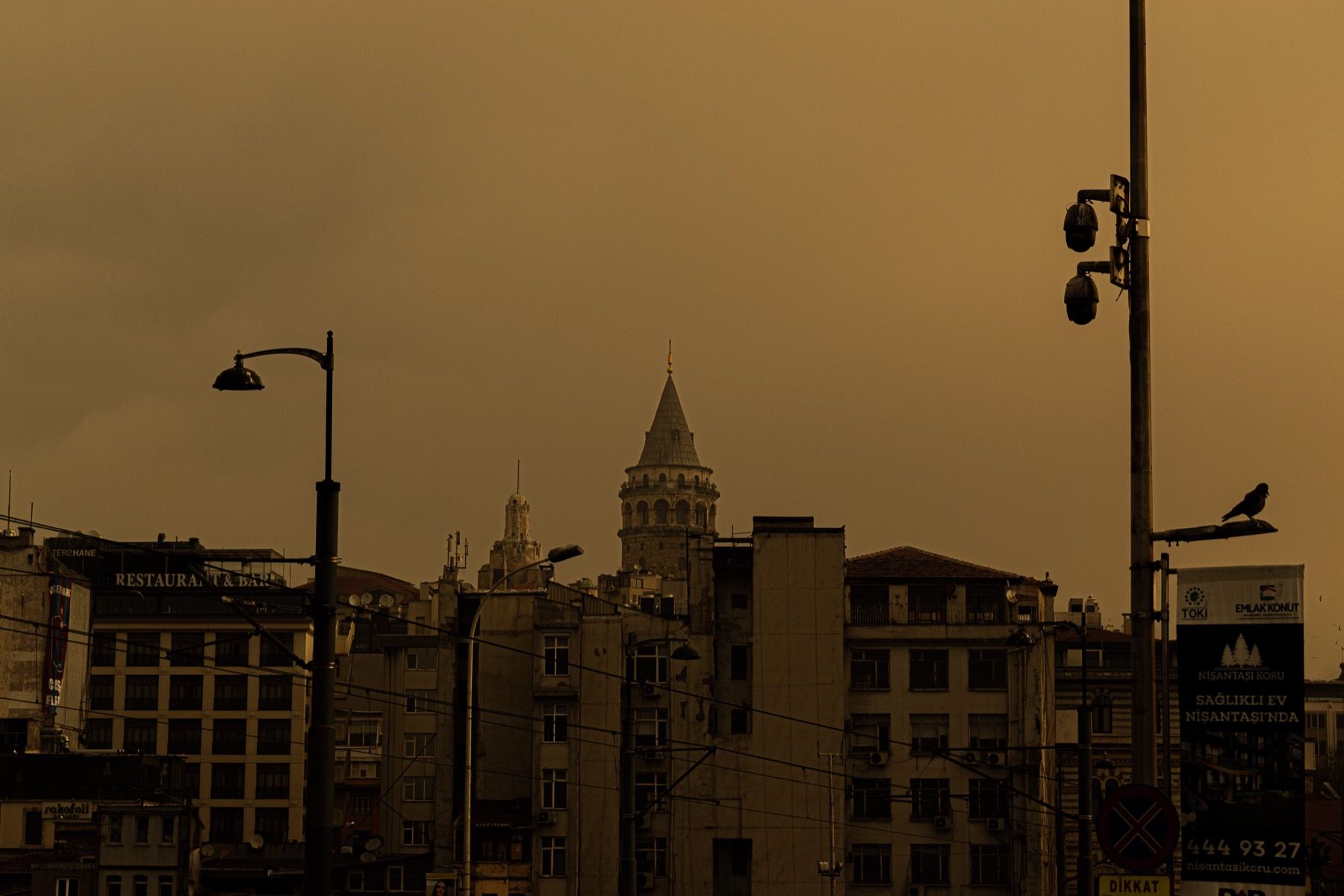 Galata Tower above Istanbul rooftops in golden light